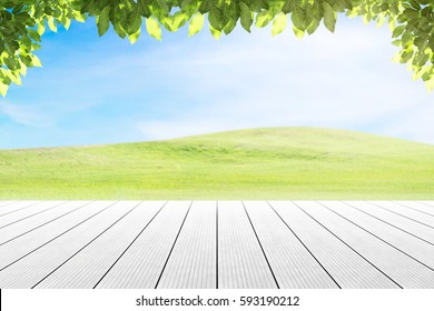 Wood Table Top On Mound Slope Green Grass Natural Background. Concept Party,display, County, Products,natural,farm,organic.