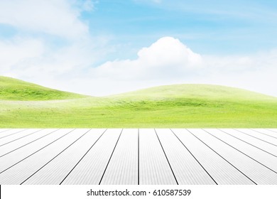 Wood Table Top On Mound Slope Green Grass Natural Background. Concept Party,display, County, Products,natural,farm,organic.