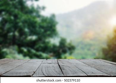 Wood Table Top On Mountain Blur Background Image, For Product Display Montage.