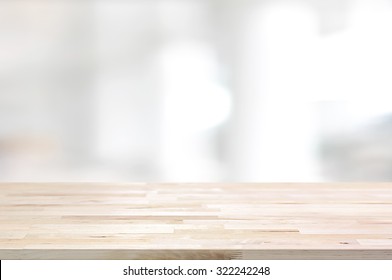 Wood table top on white blurred abstract background from building hallway  - can be used for display or montage your products