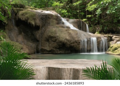 Wood table top podium floor in outdoor waterfall green tropical forest nature background.Natural water product present placement pedestal counter display, spring summer jungle paradise concept. - Powered by Shutterstock