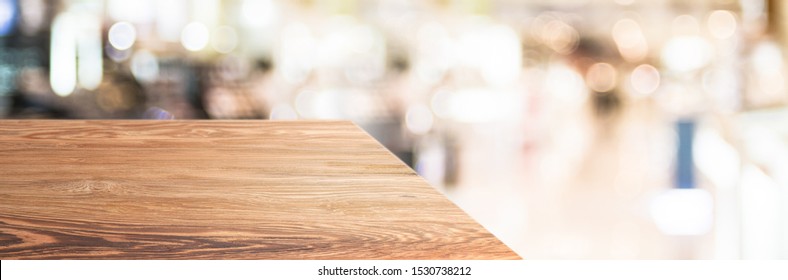 Wood Table Top Product Display Background With Blur Department Store.left Perspective Wooden Reception Counter With Consumer Walk In Hallway.Banner Mockup Presentation For Product