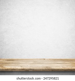 Wood Table And White Concrete Wall Background