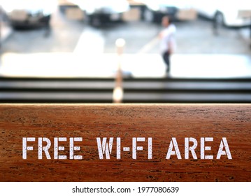 Wood With Text Inscription FREE WIFI AREA , Concept Of Wireless Internet Facility Available For Customers Or Visitors In Business Or Public Places For Modern Lifestyle Customers Satisfaction