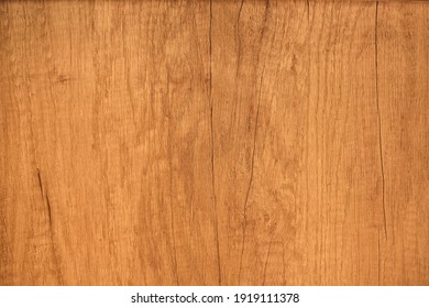 Wood texture background. Top view of vintage wooden table with cracks. Light brown surface of old knotted wood with natural color.