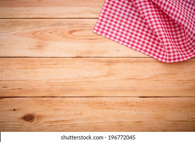 Wood Texture Background. Wooden Table Covered With Tablecloth Cloth Checkered Plaid Red. View From Top. Empty Tablecloth For Product Montage For Recording Menu, Recipe. Free Space For Your Text 