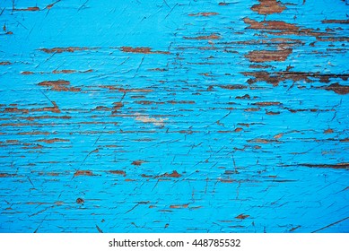 Wood texture with blue flaked paint