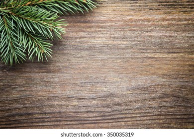 Wood texture with christmas ornament and firtree.