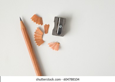 Wood Texture Pencil With Sharpening Shavings On White Background