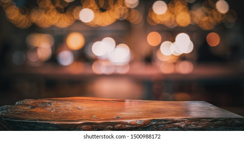 Wood Texture Table Top (counter Bar) With Blur Light Gold Bokeh In Cafe,restaurant Background.For Montage Product Display Or Design Key Visual Layout