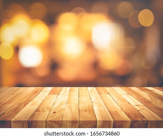 Wood Texture Table Top (counter Bar) With Blur Light Gold Bokeh Background.For Montage Product Display Or Design Key Visual Layout