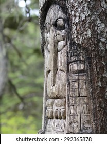 Wood Totem Pole Carved By Native Tlingit Indians Along A Trail On Top Of Mt. Roberts In Juneau, Alaska, USA. 