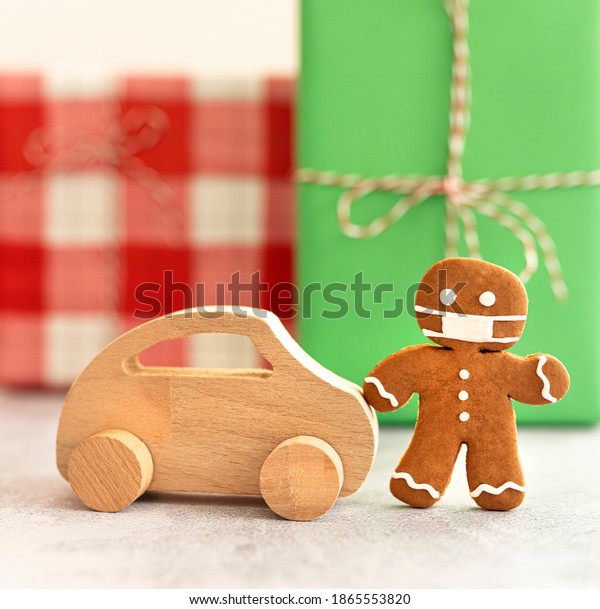 wood toy car gingerbread men with a masks.\
Christmas holiday celebration\
concept.
