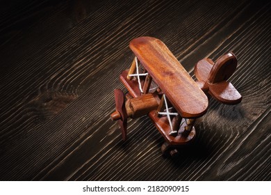 Wood Toy Plane Hand Made Model On Rustic Wooden Table.