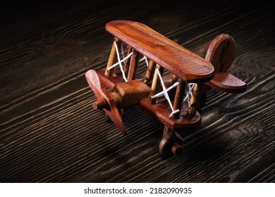 Wood Toy Plane Hand Made Model On Rustic Wooden Table.