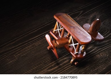 Wood Toy Plane Hand Made Model On Rustic Wooden Table.