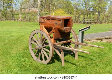 A Wood Trolley Cart In Front Of The Blacksmith Shop In Grand Pre National Historic Site, Wolfville, Nova Scotia NS, Canada. Grand-Pré Is A UNESCO World Heritage Site.