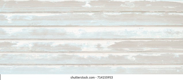 Wood Wall Siding Or Planking With Rough Textured Chipped Peeling Paint.  Blue, Aqua, Teal And Off White Paint Finishes Worn And Sanded Off. Vintage Texture For Horizontal Background.