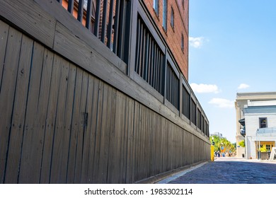 Wood Wall Under A Brick Building In The Old Harbor Port City Of Wilmington, NC.