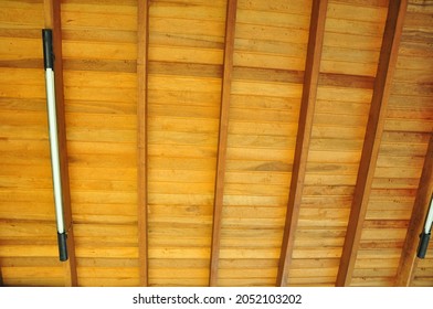 
Wood. Wooden Ceiling With Installed LED Lights, Beams And Rafters In Symmetry, In Natural Wood Color, Brazil, South America, Zoom