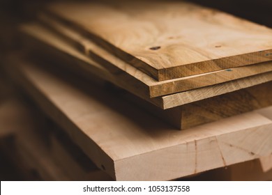 Wood working industry stack of wooden planking lath board joist table close up front view. Wood based materials.