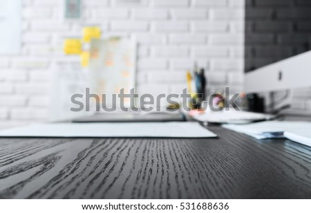 Wood working table in black and computer with copy space top view.For table background ideas and business concept.