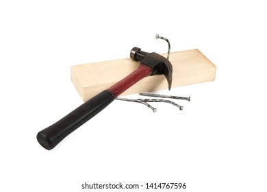 Wood Working Tools Hammer And Bent Nails In A 2x4 Piece Of Wood Isolated On White