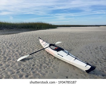 Woodbine, Georgia, USA - Nov. 26, 2016: A Folding Kayak Stills On The Sand Of The Salt Marsh Along The Shore At Crooked River State Park.