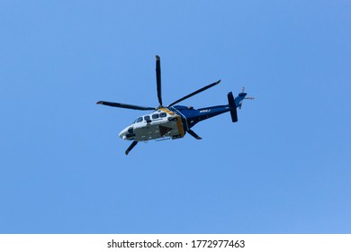 WOODBRIDGE, NEW JERSEY - June 1, 2020: A New Jersey State Police Helicopter Circles The Area During Late Spring