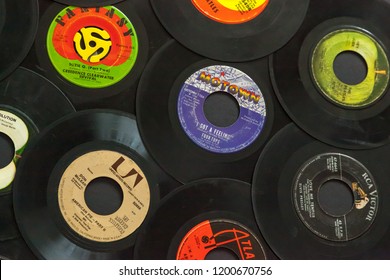 Woodbridge, New Jersey / United States - October 11, 2018: A collection of 1960s 45 speed records, including the Beatles, Don McLean, Four Tops, Aretha Franklin, and Creedence Clearwater Revival.