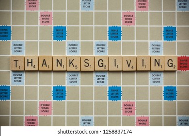 Woodbridge, New Jersey / United States - November 9, 2018: Scrabble Tiles Spell Out The Word Thanksgiving On A Vintage Game Board