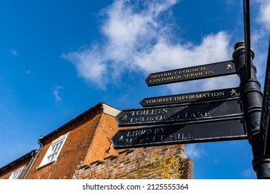 Woodbridge Suffolk UK February 16 2022: Public Information Sign Showing The Direction To Different Attractions And Public Services Such As Toilets, Customer Services And The Library