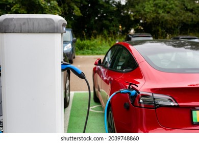 Woodbridge Suffolk UK September 01 2021: Electric Car Charging At Plug In Charge Station In A Public Car Park In Suffolk, UK