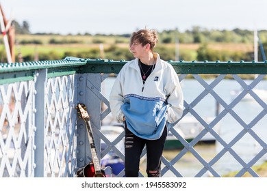 Woodbridge, Suffolk, UK September 20 2020: A 20 Something Female Relaxing And Posing With Her Acoustic Guitar