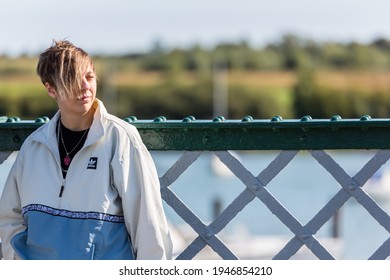 Woodbridge, Suffolk, UK September 20 2020: A 20 Something Female Relaxing And Posing With Her Acoustic Guitar