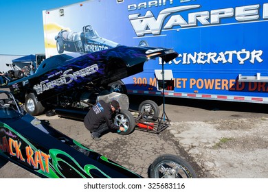 WOODBURN, OR - SEPTEMBER 27, 2015: Mechanic Working On A Jet Dragster For The Darin Bay's Warped Speed Team At The NHRA 30th Annual Fall Classic At The Woodburn Dragstrip.