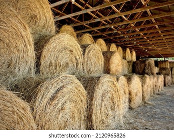 Woodbury, NY, USA - Jun 30th 2018: hay bales stored in a barn. Hay bales stored in a barn on farm in Woodbury NY.