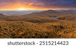 Wooded sunset hills of Appalachian mountains in North Carolina with lush and evergreen forest trees at fall season. Beauty of autumnal nature