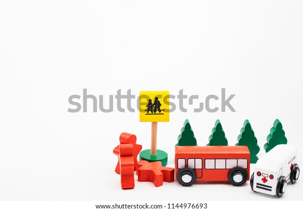 Wooded\
toy car are crashed. Accident road traffic with wooden toy cars in\
the town on white background, safety and traffic regulations\
concept, backgrounds.Transportation system\
concept