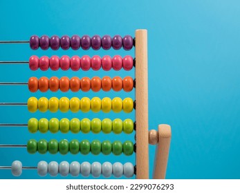 Wooden abacus on a blue background, Wooden abacus for children. Wooden abacus close-up. - Powered by Shutterstock