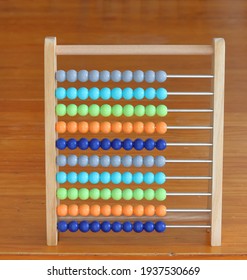 Wooden abacus on a wooden table