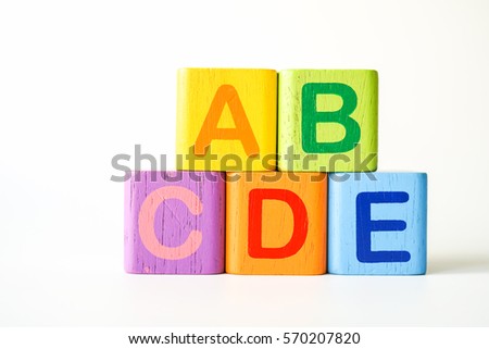 Wooden ABC Blocks writing word ABCDE on white background with copyspace, ABC Word for Learning and development background concept