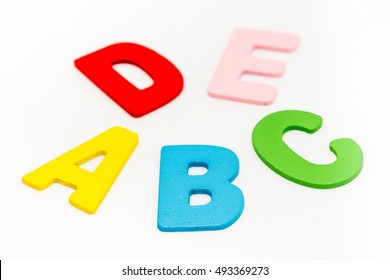 Wooden ABC Letters Isolated on White Background.