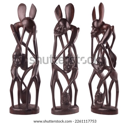A wooden african figurines from ebony isolated over a white background
