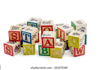 The wooden alphabet blocks on a white background