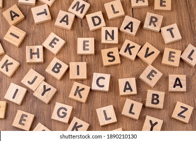 Wooden alphabet on the wooden table - Shutterstock ID 1890210130