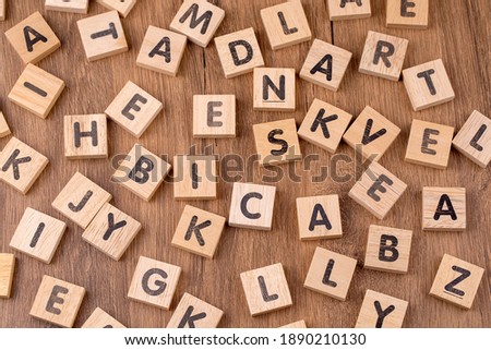Wooden alphabet on the wooden table