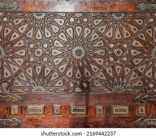 Wooden arabesque decorations tongue and groove assembled, inlaid with ivory and ebony, at Quran reading bench, at historic public Mosque of Al Rifai, Cairo, Egypt