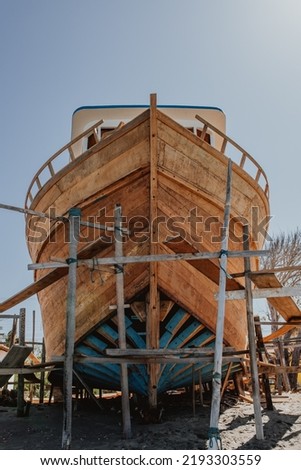 Wooden ark under construction by the beach. Icapuí, Ceará, Brazil. Boat under development.