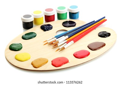 Wooden Art Palette With  Paint And Brushes Isolated On White